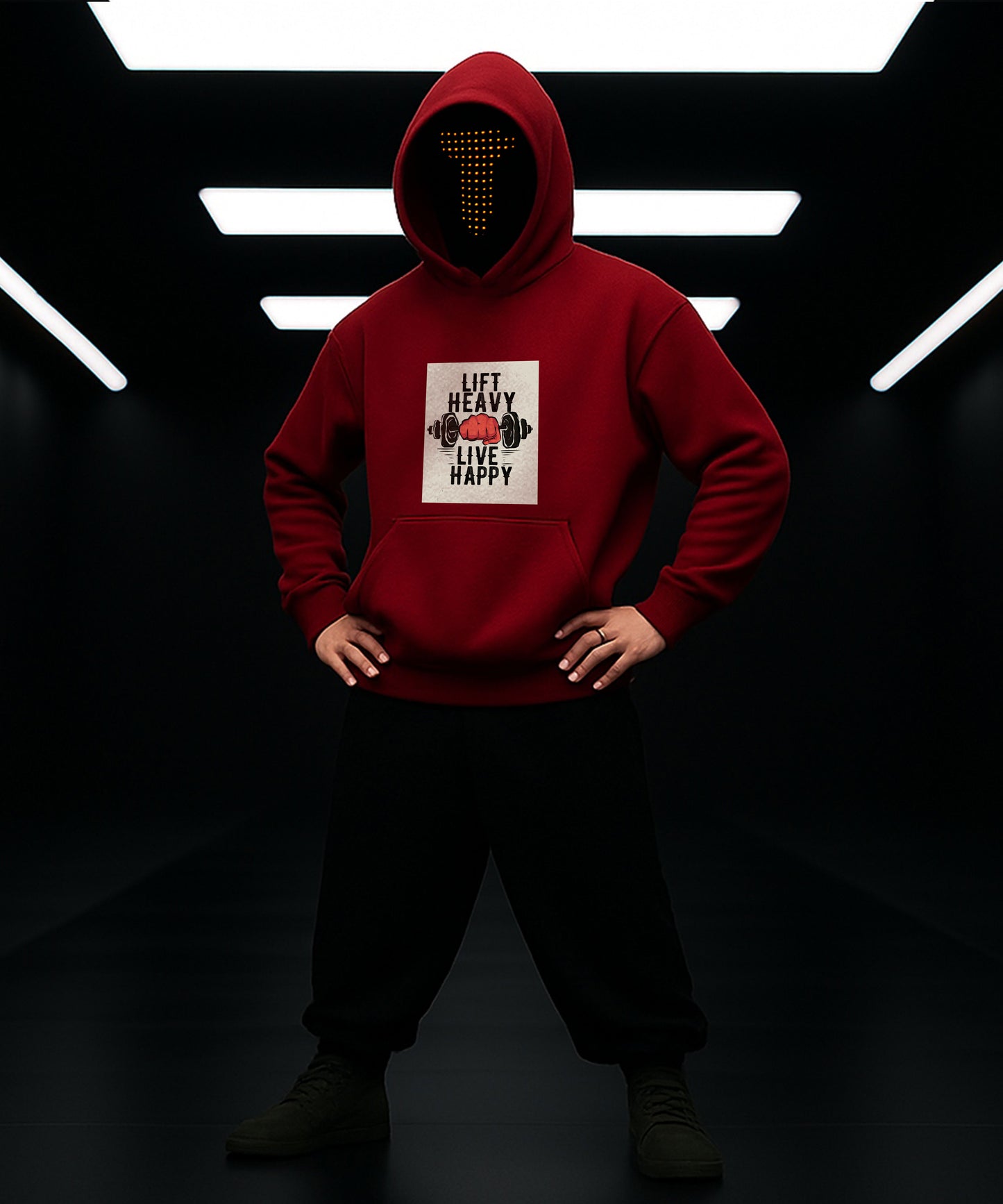 Person wearing a red hoodie with a graphic design in a dark setting