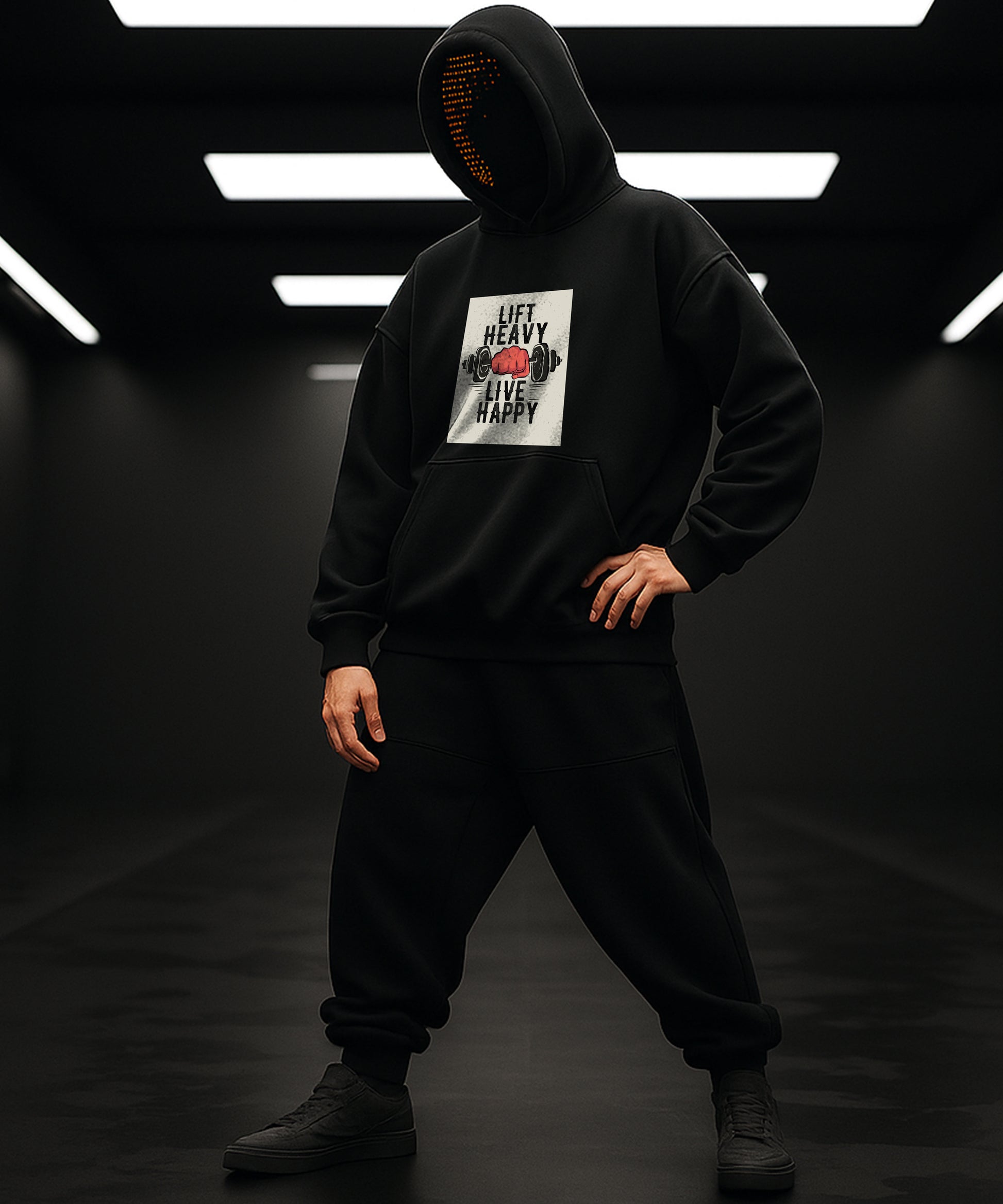Person wearing a black hoodie with a graphic design on a dark background