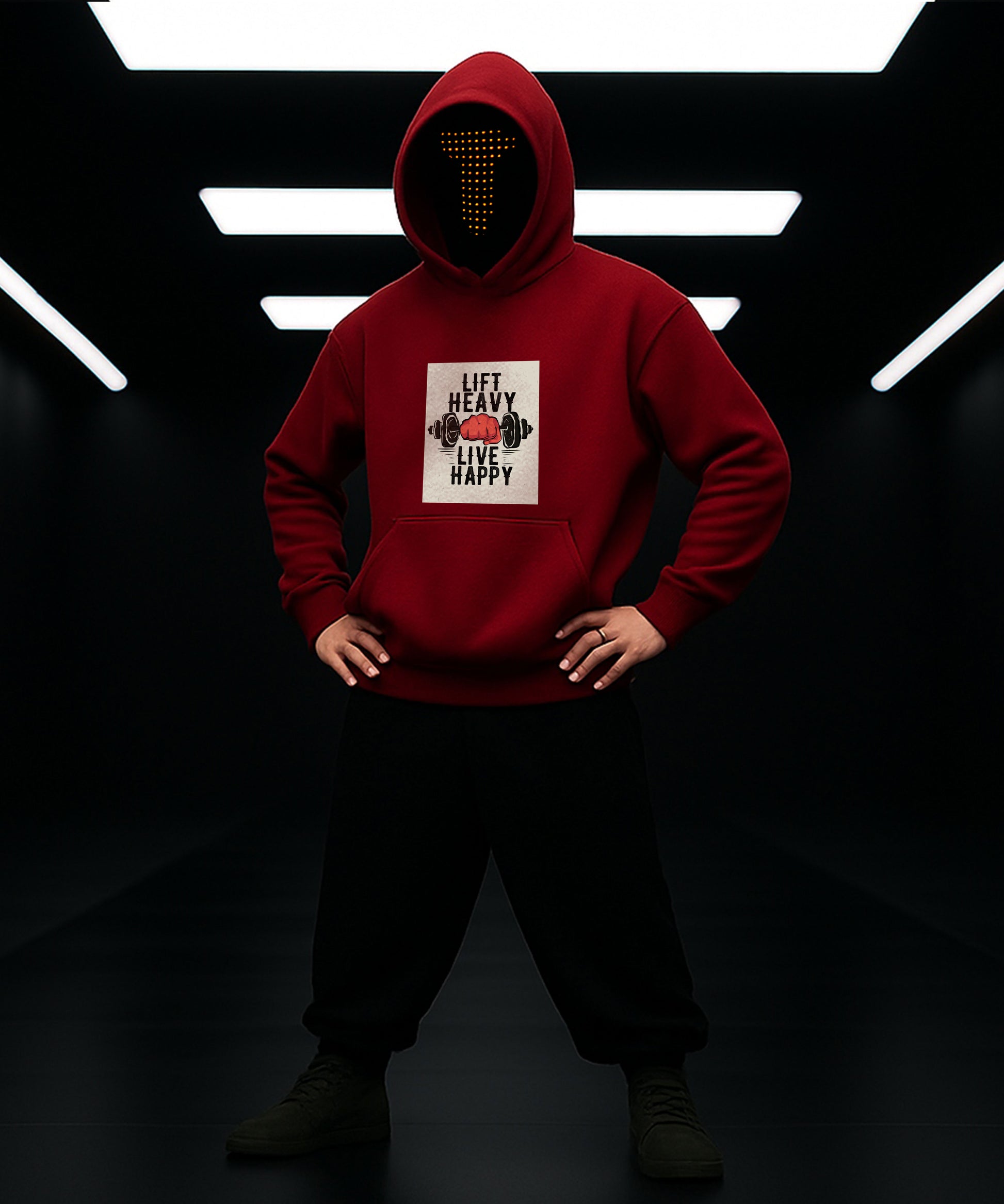 Person wearing a red hoodie with a graphic design in a dark setting